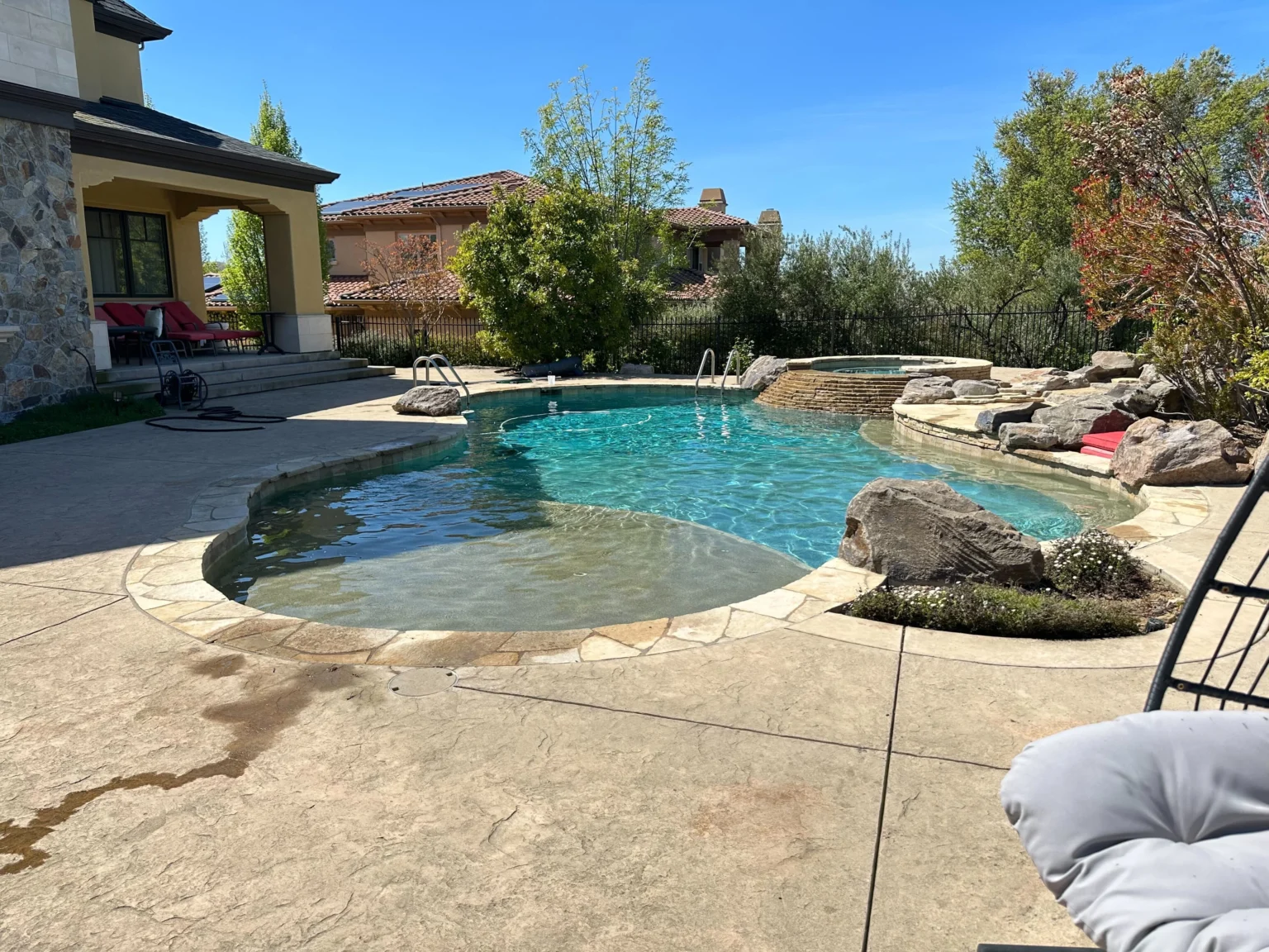 Resort-Style Backyard Pool with Spa and Natural Stone Accents | Sun Pointe Services